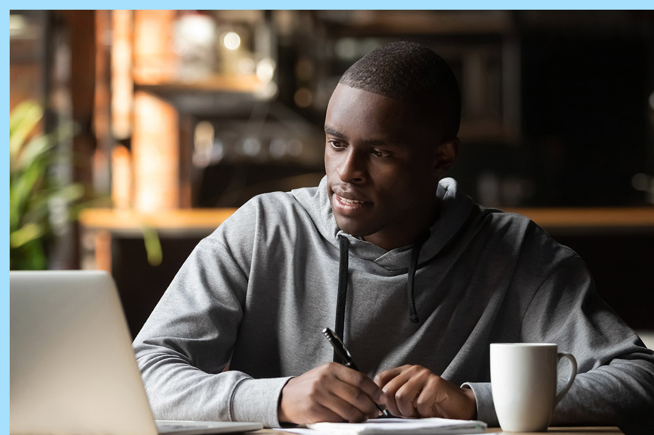 adult studying in a coffee shop