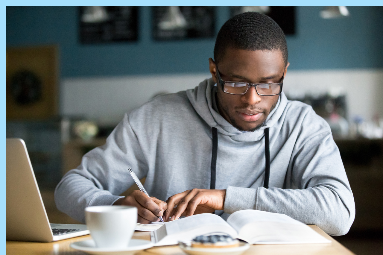 man studying in a coffee shop