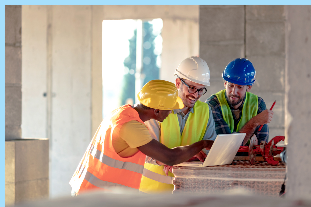 construction workers looking at plans